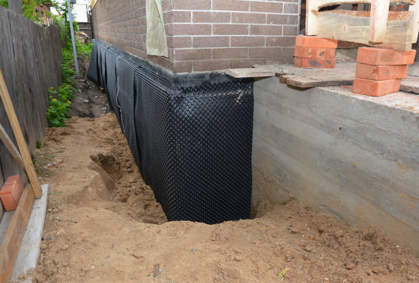 SJ Waterproofing Pros technician performing targeted Sump Pump Installation assessment in Whitehall, WI